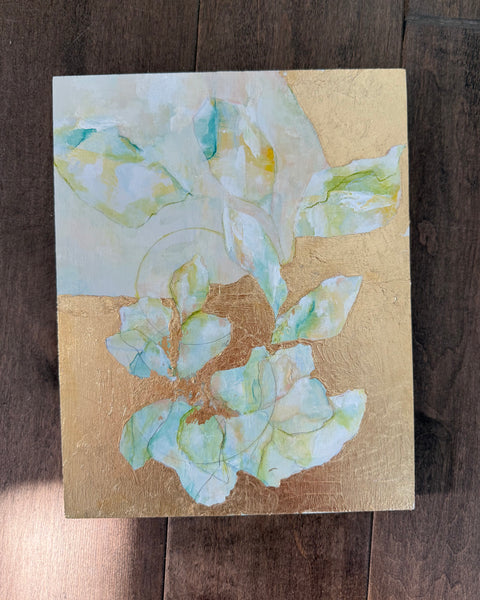 Artistic depiction of flowers on a gold leaf background